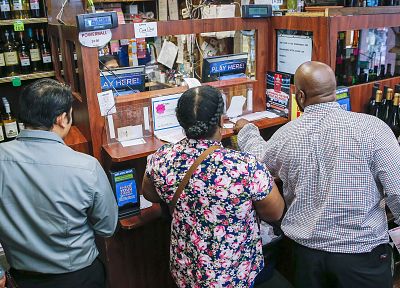 Customers purchase Mega Millions lottery tickets at a retailer in Washington, DC on Oct. 20, 2018.