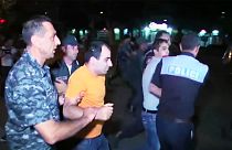 Dozens wounded in further night of clashes at besieged Yerevan police station
