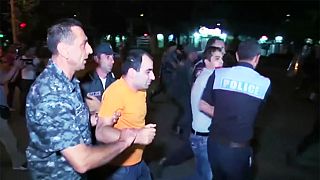 Dozens wounded in further night of clashes at besieged Yerevan police station