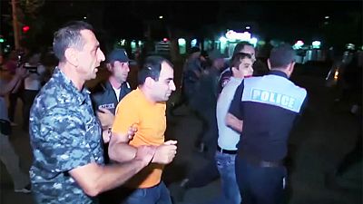Dozens wounded in further night of clashes at besieged Yerevan police station