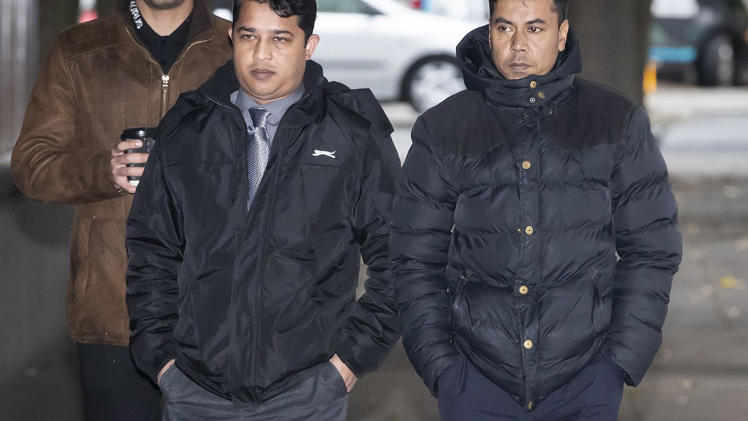 Harun Rashid, left, 38, and Mohammed Kuddus, right, 40, arrive at Mancheste