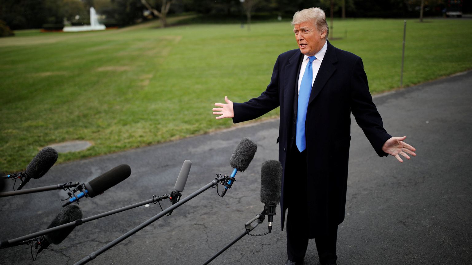 President Donald Trump talks to reporters on the South Lawn of the White Ho