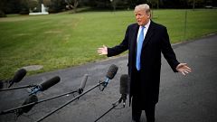 President Donald Trump talks to reporters on the South Lawn of the White Ho