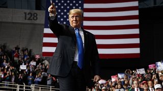 Donald Trump arrives to speak at a campaign rally at Bojangles' Coliseum in