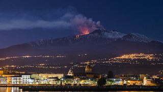 Image: Mount Etna spews lava as the Sicilian town of Riposto