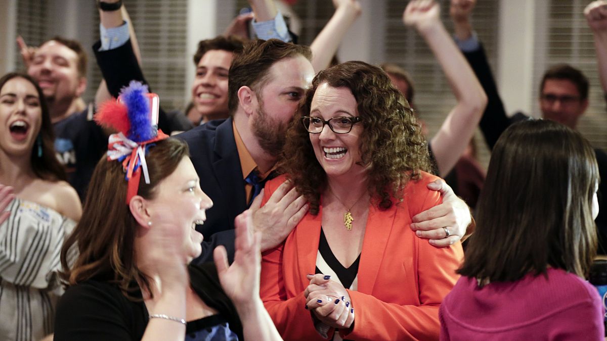 Image: Kara Eastman is hugged by her campaign manager