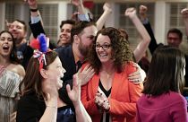 Image: Kara Eastman is hugged by her campaign manager