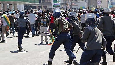 Zimbabwe police disperse protesters with water canon and tear gas