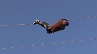 Villagers in Syria take broken power lines into their own hands...literally