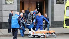 Image: Medics work at the site of an explosion at an office of Russia's Fed