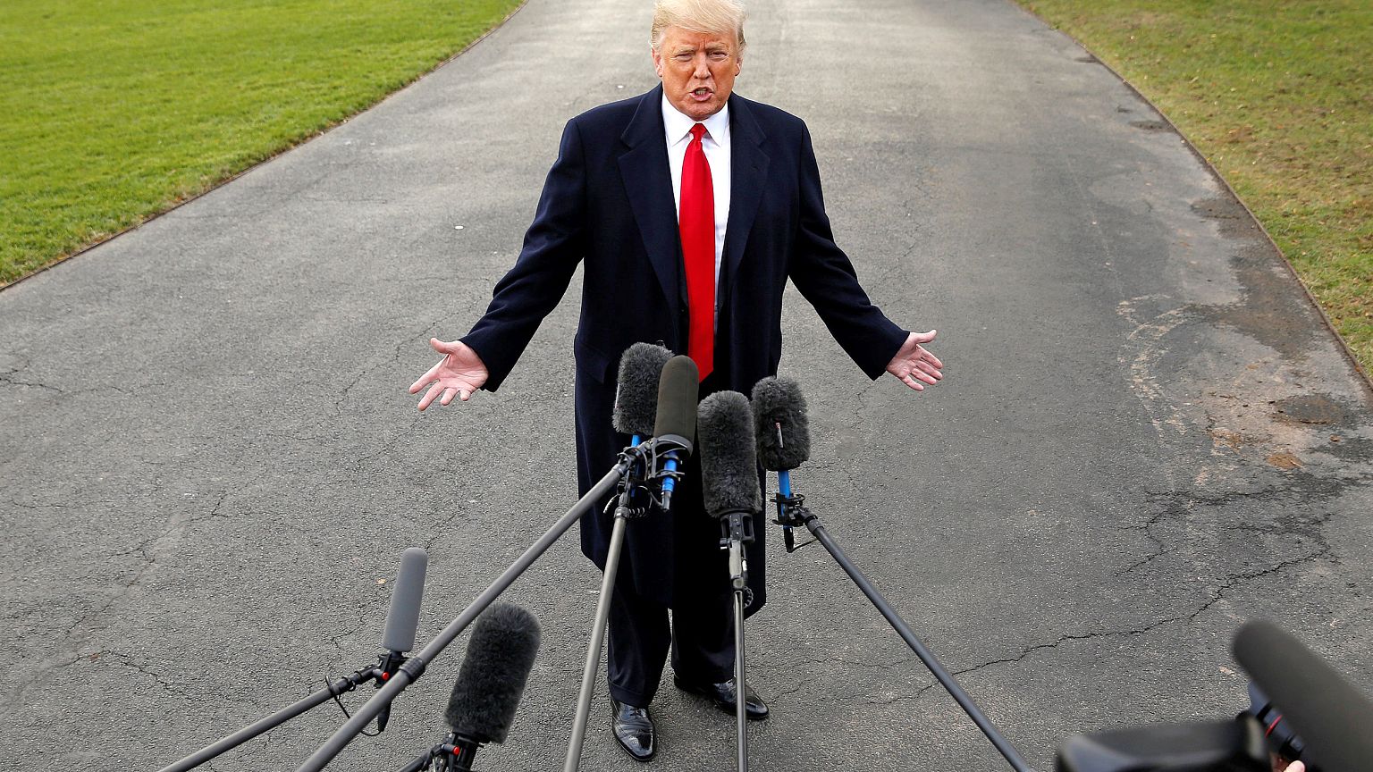 Image: U.S. President Donald Trump speaks to the media as he departs for a 