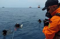 Image: Rescue personnel searching the waters for wreckage from Lion Air fli