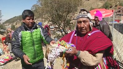 Bolivia: believers of the Virgin of Urkupina break rocks to ask for favours during a religious procession
