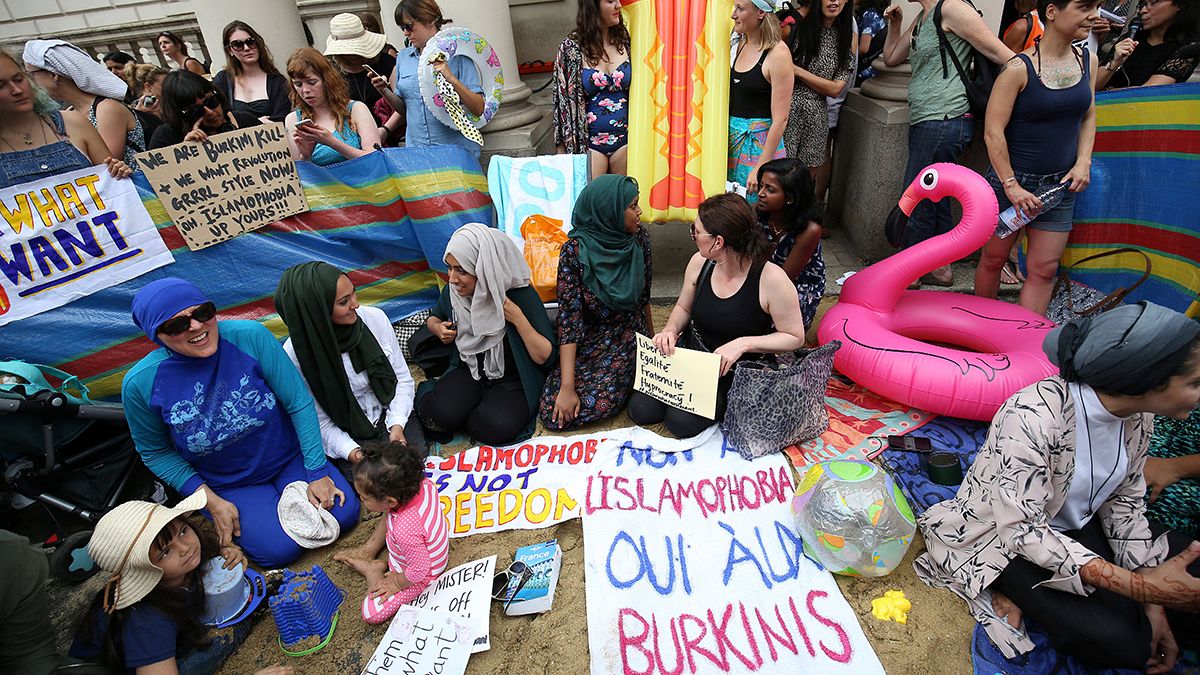 Burkini ban in parts of France provokes beach-themed protest in London