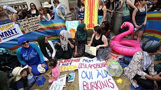 Burkini ban in parts of France provokes beach-themed protest in London