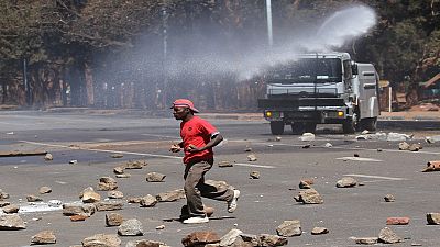 Zimbabwean police fire tear gas to disperse demonstrators
