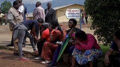 Image: Parents await for news of their children at a school where 79 pupils