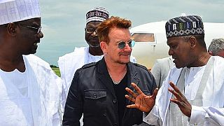 [Photos] Dangote and Bono visit displaced people in Borno State