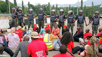 [Photos] Chibok Girls activists march to Buhari with lips sealed, blocked by police