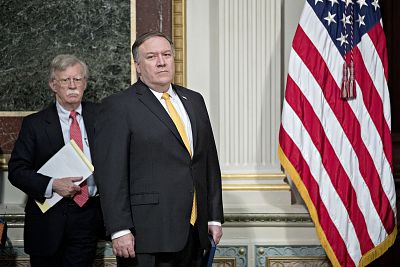 National Security Adviser John Bolton, left, and Secretary of State Mike Pompeo attend a meeting at the Eisenhower Executive Office Building in Washington, D.C. on Oct. 11, 2018.
