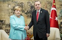 Merkel "upbeat" after talks with Erdogan in China