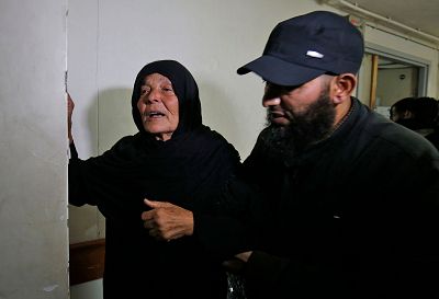 The mother of Nour Baraka, a commander for Hamas\' armed wing, reacts at the morgue where his body was transported.
