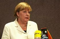 Merkel resists pressure to change refugee policy