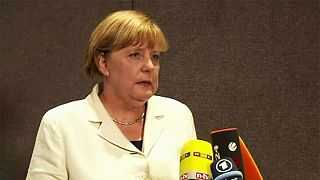 Merkel resists pressure to change refugee policy