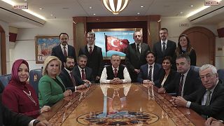 Image: Turkish President Recep Tayyip Erdogan poses for photos with Turkish