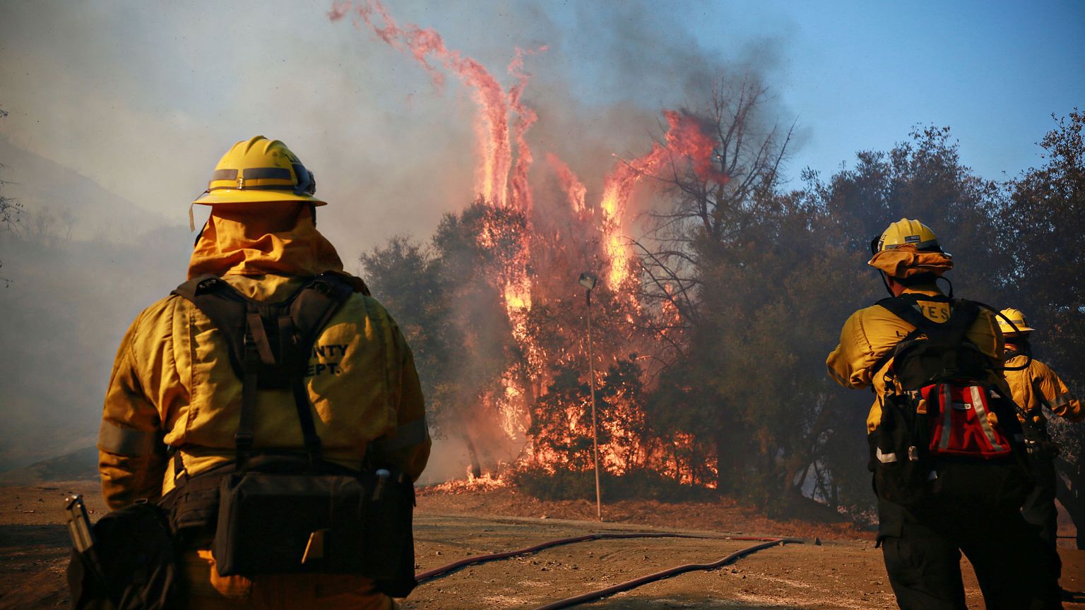 Image: Firefighters battle a blaze at the Salvation Army Camp