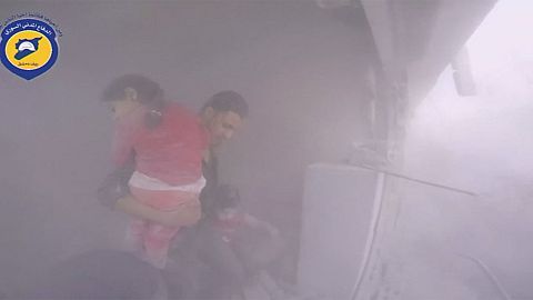 Syria: Young child being rescued – Jets struck a market place