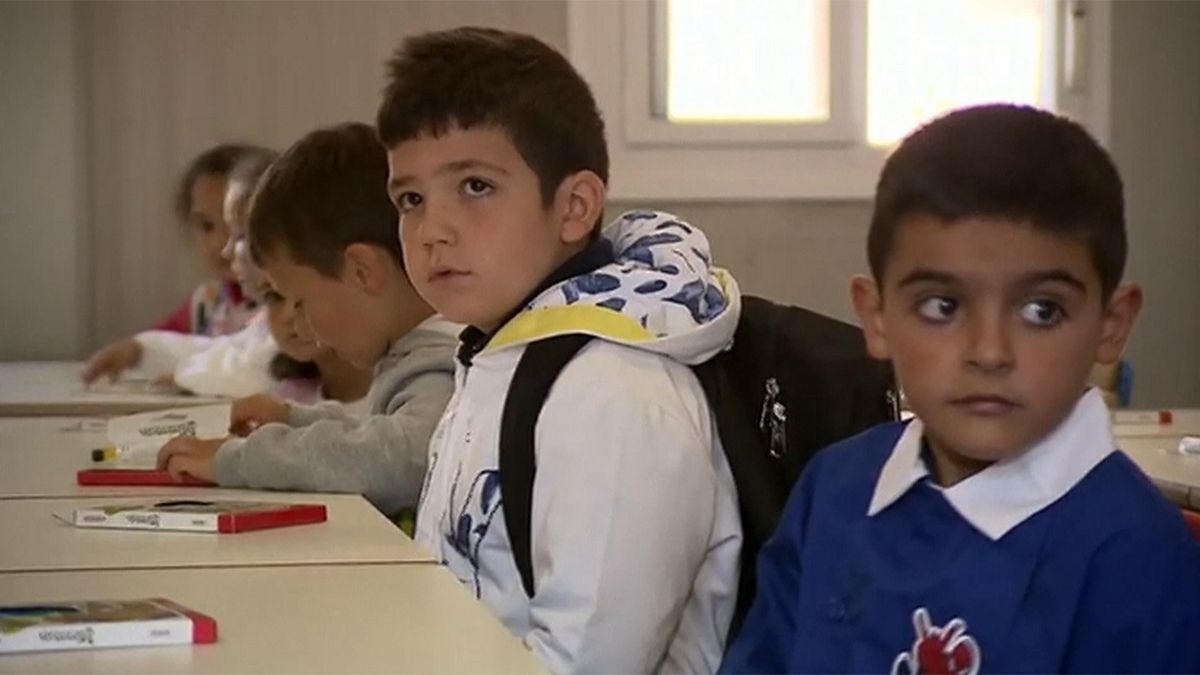 Children of quake-hit Italian town go back to school - in prefabs