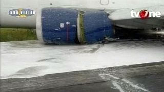 Landing without wheels: cargo plane skids down Indonesian runway