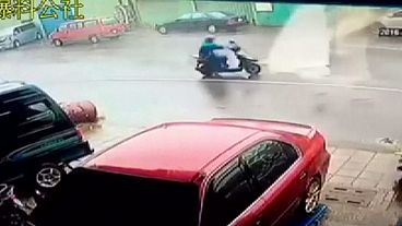 Taiwan: Motorbike rider blown away by typhoon