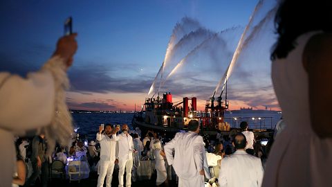 Who'll pay the laundry bill? 'Dinner in white' attracts thousands in New York