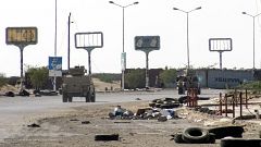 Image: Armoured vehicles of the Yemeni pro-government forces are seen drivi