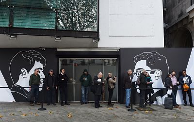 Fans line up outside the World Chess Championship 2018 in London.