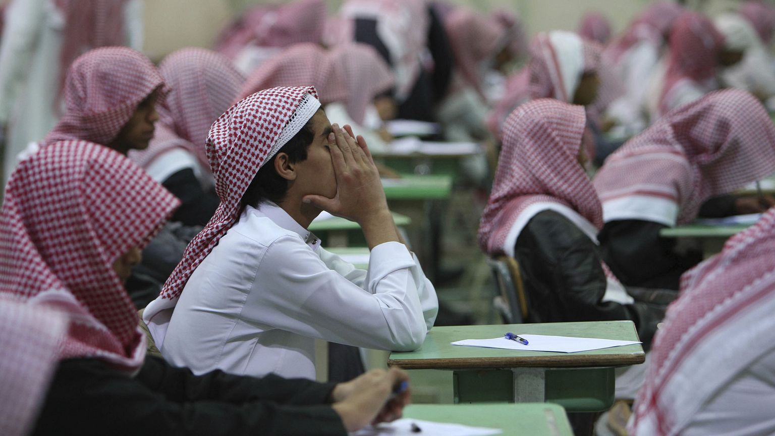Image: Secondary school students sit for an exam in a government school in 