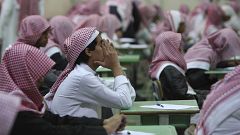 Image: Secondary school students sit for an exam in a government school in 