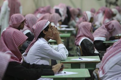 Secondary school students sit for an exam at  a government school in Riyadh.