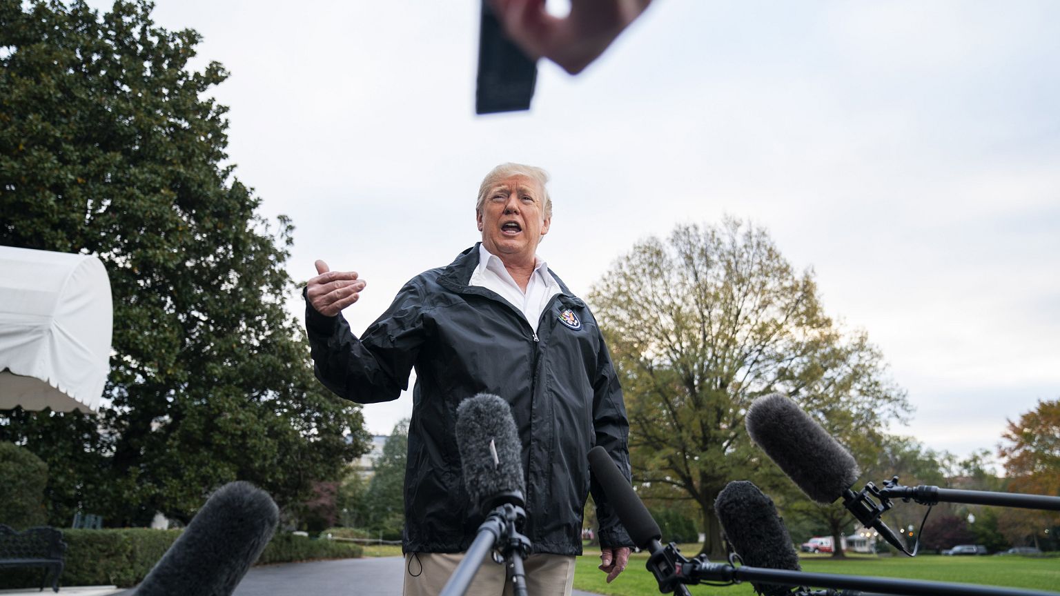 Image: Trump speaks before departing White House to view wildfire damage in
