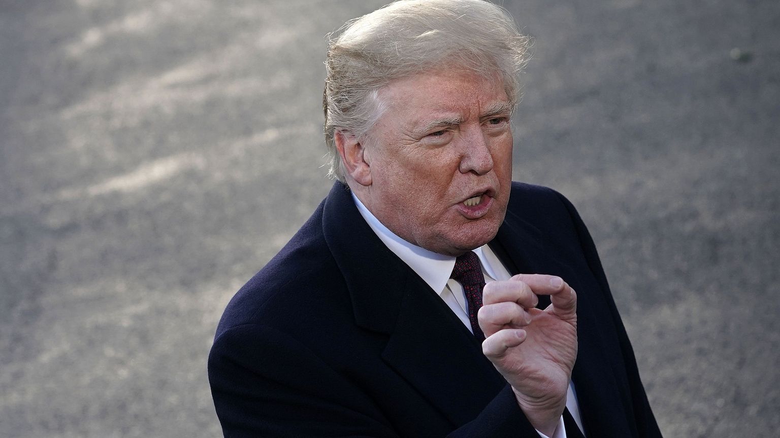 President Donald Trump speaks to the media prior while departing the White 