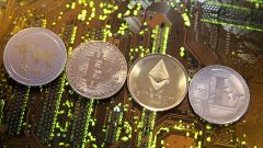 Image: Representations of the Ripple, Bitcoin, Etherum and Litecoin virtual