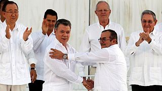 Colombians call for 'no more war' as historic peace deal is signed between Farc rebels and the government
