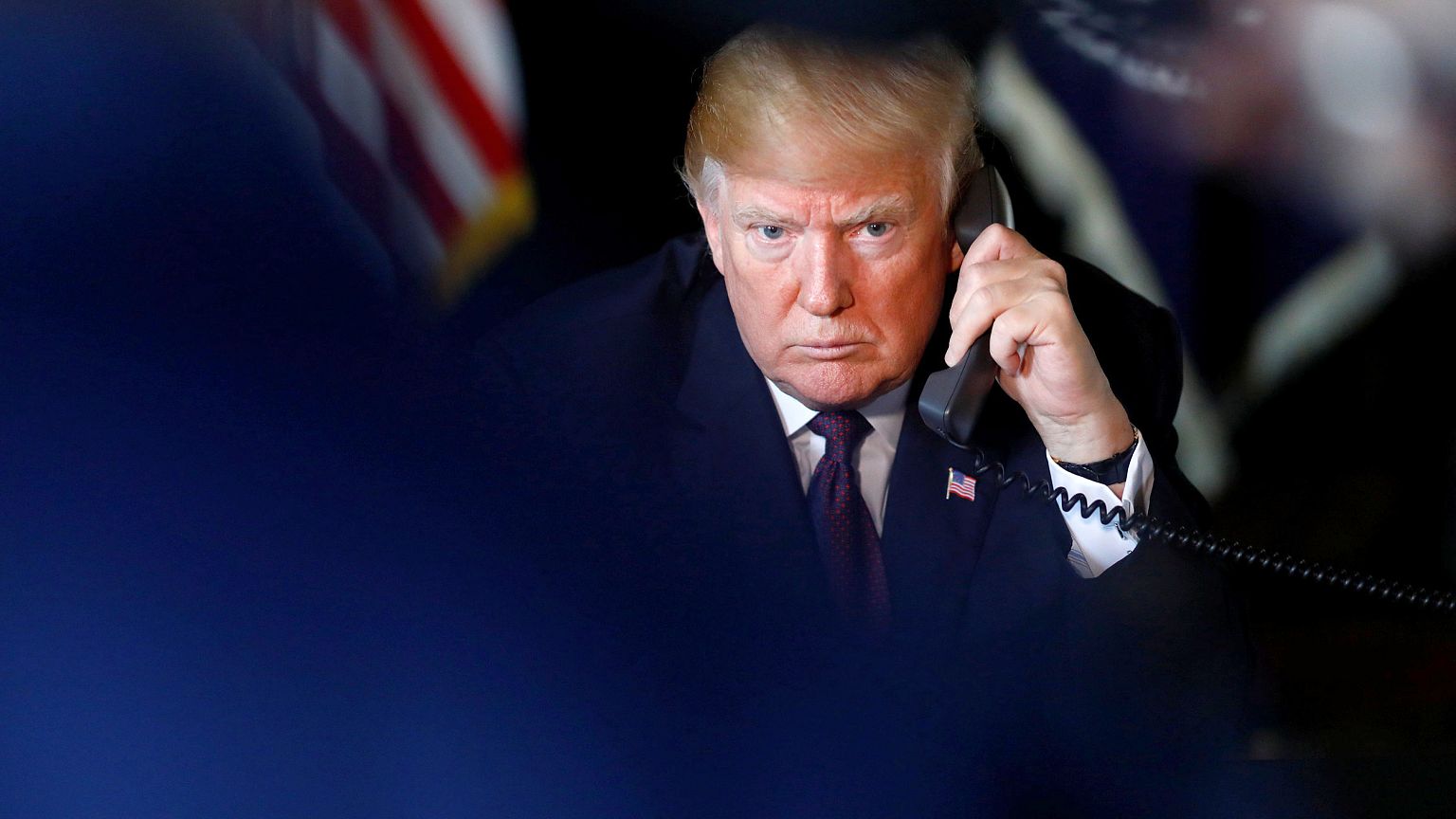 Image: U.S. President Donald Trump speaks via video teleconference with tro