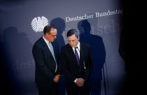Draghi faces off against German critics