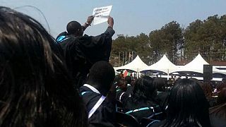 University students arrested after criticizing Mugabe in his face