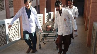 Image: Paramedics transport a victim after Friday's suicide bombing