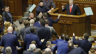 Ukrainian President Petro Poroshenko speaks during a parliament session to