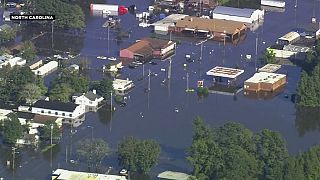 Thousands evacuated from flooded Carolinas